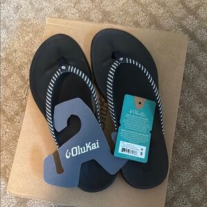 Olukai Black & white stripes Flip Flops, brand new with tags and box!